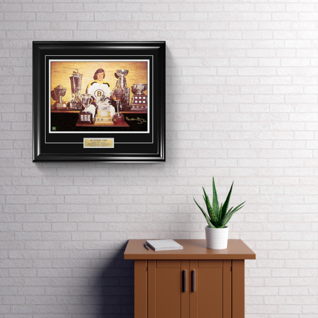 Bobby Orr Signed and Framed 18" x 24" Boston Bruins Trophies Photo - Frameworth Sports Canada