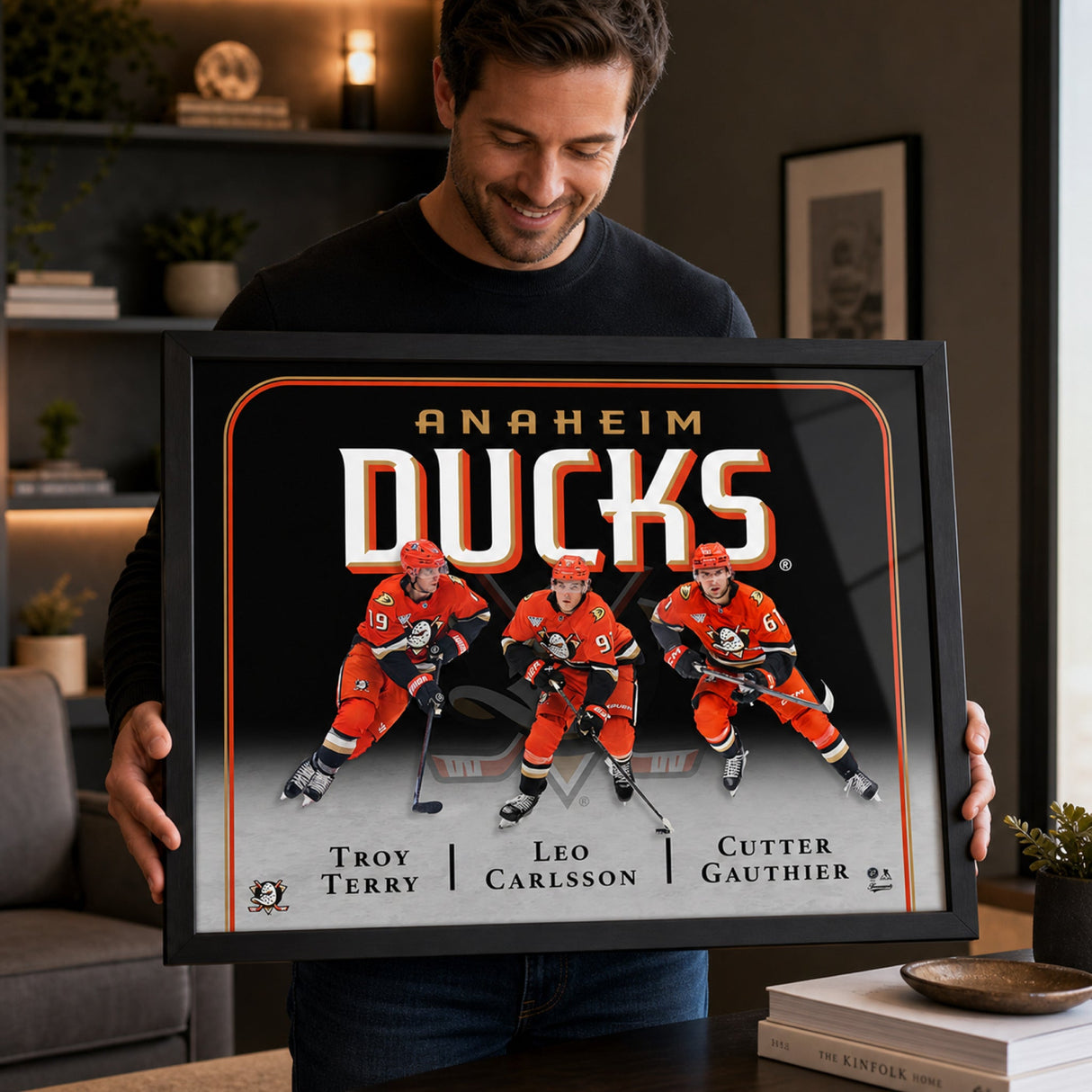 Collector holding Anaheim Ducks Triple Player Collage Frame – gift framing – Frameworth
