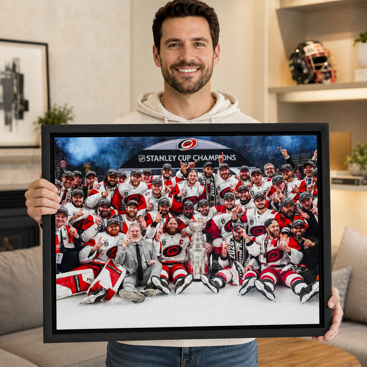 Carolina Hurricanes 20x29 Framed Canvas Celebration 2026 Stanley Cup Champions - collector holding framed canvas image