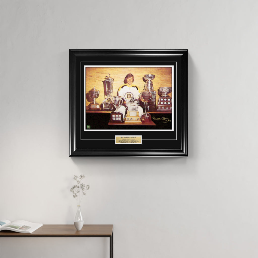 Bobby Orr Signed and Framed 18" x 24" Boston Bruins Trophies Photo - Frameworth Sports Canada
