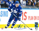 John Tavares Toronto Maple Leafs Signed Unframed 8x10 Skating with the Puck Photo - Frameworth Sports Canada 