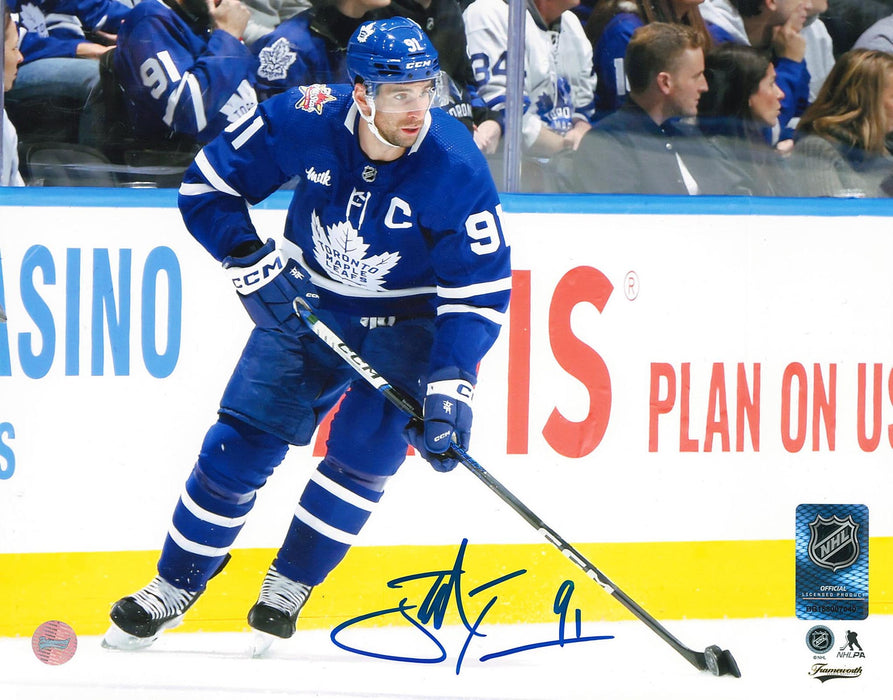 John Tavares Toronto Maple Leafs Signed Unframed 8x10 Skating with the Puck Photo