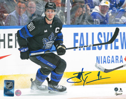 John Tavares Toronto Maple Leafs Signed Unframed 8x10 Skating with the Puck Photo - Frameworth Sports Canada 