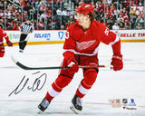 Moritz Seider Detroit Red Wings Signed 8x10 Red Jersey Skating Photograph