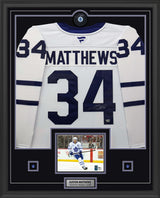 Auston Matthews Signed Toronto Maple Leafs framed 34x42 Away Fanatics Premium Jersey with Signed Puck - AUCTION