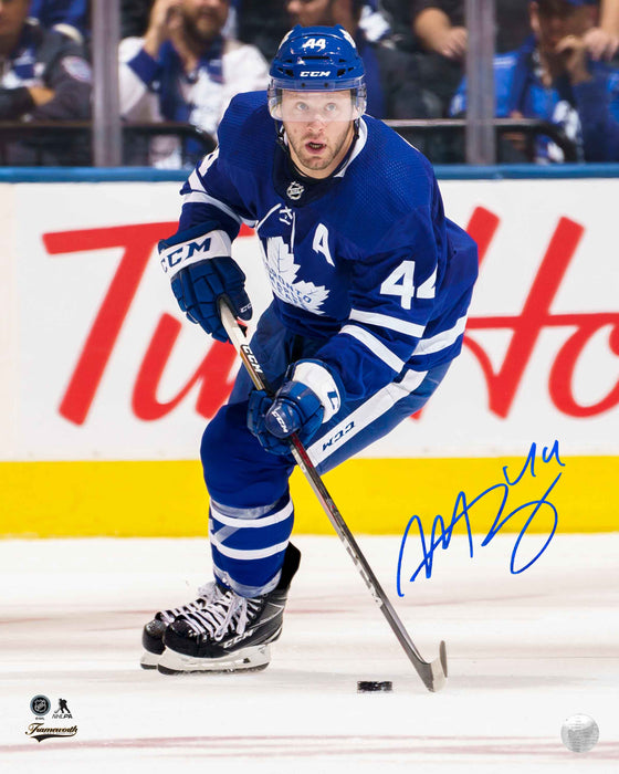 Morgan Rielly Toronto Maple Leafs Signed 8x10 Skating with Puck Photo - Frameworth Sports Canada 