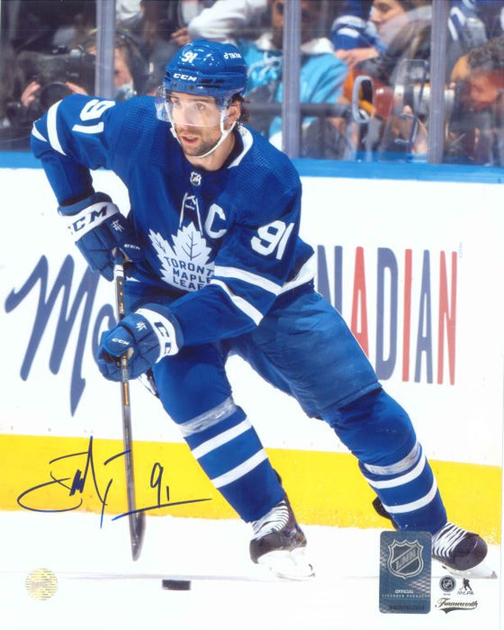John Tavares Toronto Maple Leafs Signed Unframed 8x10 Skating with the Puck Photo - Frameworth Sports Canada 