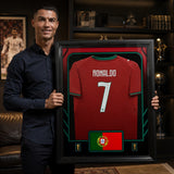 Cristiano Ronaldo Framed 25.75 x 33.75 FIFA World Cup 2026 Portugal Official Home Stadium Replica Puma Jersey - player holding lifestyle display