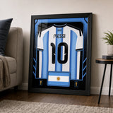 Lionel Messi Framed 25.75 x 33.75 FIFA World Cup 2026 Argentina Official Home Stadium Replica Adidas Jersey - scale context lifestyle display