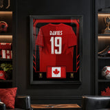 Alphonso Davies framed Canada FIFA World Cup 2026 jersey - Dark fan cave lifestyle display