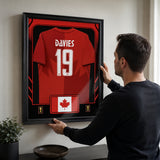 Alphonso Davies framed Canada FIFA World Cup 2026 jersey - Being installed on the wall