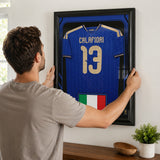 Riccardo Calafiori framed Italy FIFA World Cup 2026 jersey - Being installed on the wall