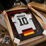 Jamal Musiala framed Germany FIFA World Cup 2026 jersey - Unboxing presentation in shipping packaging