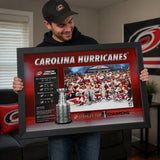 Carolina Hurricanes 16x24 Frame 2026 Stanley Cup Champions Stats - collector holding framed print image