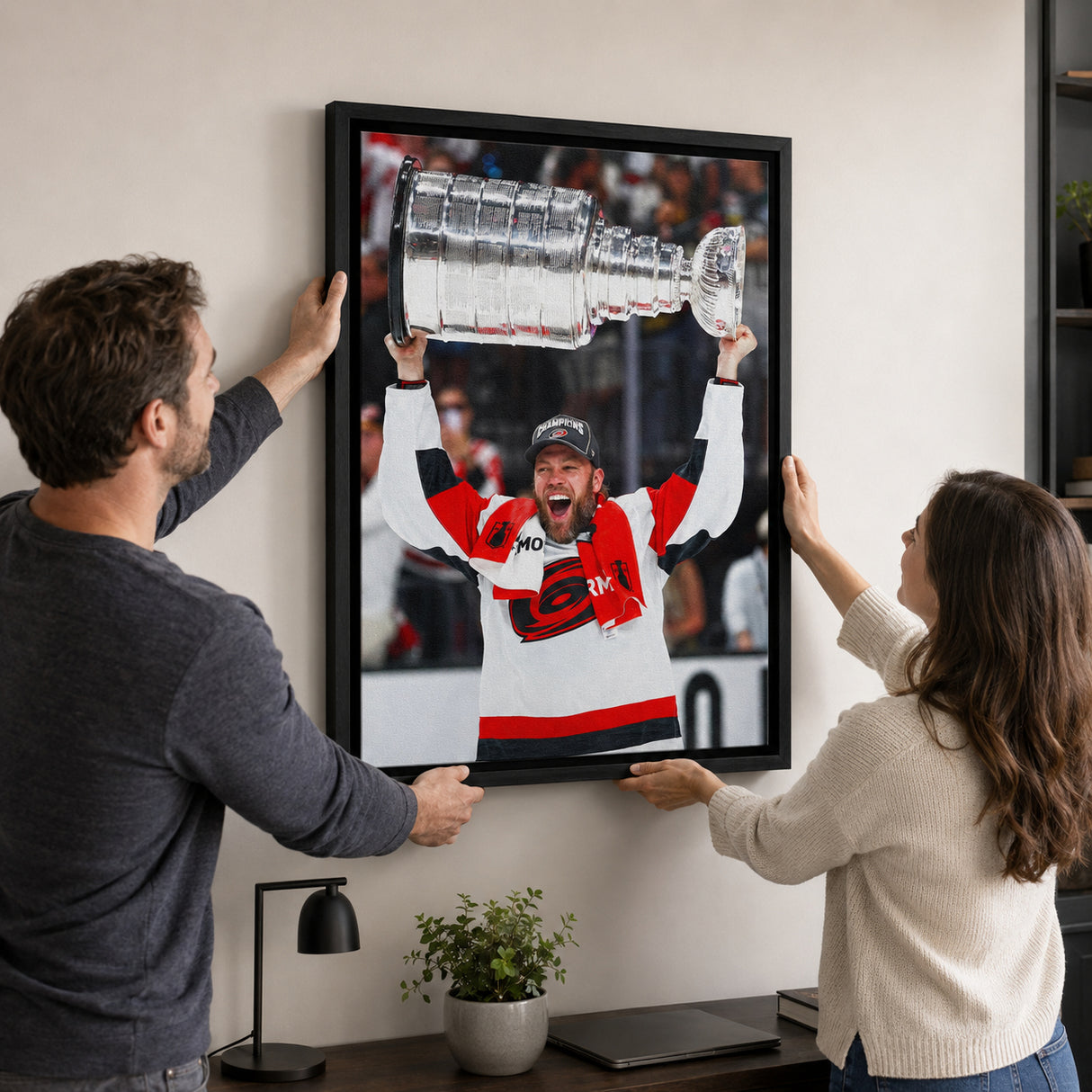 Taylor Hall 20x29 Framed Canvas Carolina Hurricanes 2026 Stanley Cup Champions - hanging installation lifestyle image