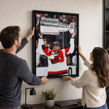 Taylor Hall 20x29 Framed Canvas Carolina Hurricanes 2026 Stanley Cup Champions - hanging installation lifestyle image