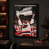 Sebastian Aho 20x29 Framed Canvas Carolina Hurricanes 2026 Stanley Cup Champions - display wall lifestyle image