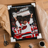 Sebastian Aho 20x29 Framed Canvas Carolina Hurricanes 2026 Stanley Cup Champions - collector holding framed canvas image
