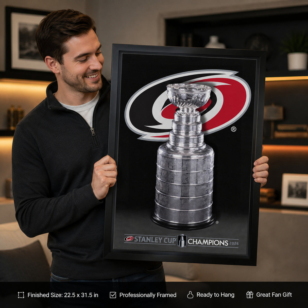 Carolina Hurricanes 20x29 Framed Canvas 2026 Stanley Cup Champions - collector holding framed canvas image
