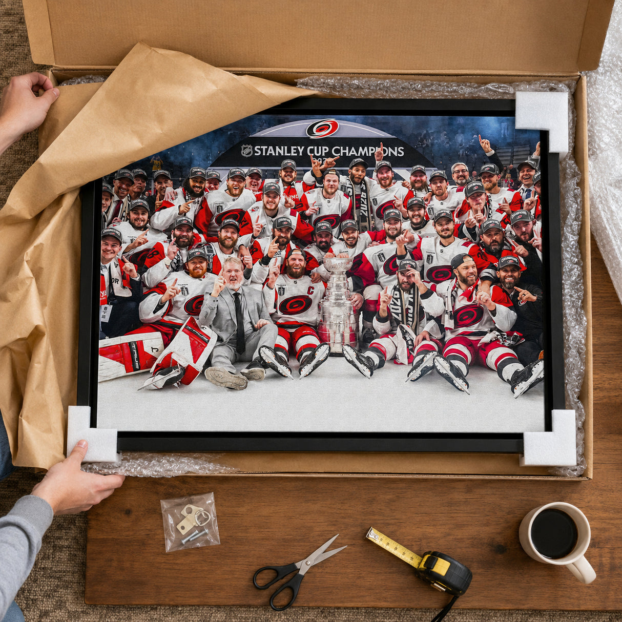 Carolina Hurricanes 20x29 Framed Canvas Celebration 2026 Stanley Cup Champions - unboxing lifestyle image