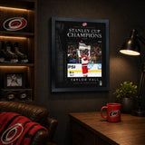 Taylor Hall 16x20 PhotoGlass frame Carolina Hurricanes 2026 Stanley Cup Champions displayed in a fan room
