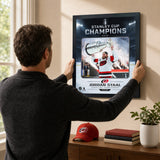 Jordan Staal Ice Design 16x20 PhotoGlass frame Carolina Hurricanes 2026 Stanley Cup Champions shown being hung as framed wall art