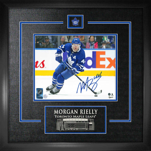 Morgan Rielly Signed Framed Toronto Maple Leafs Blue Skating With Puck 8x10 Photo - Frameworth Sports Canada 