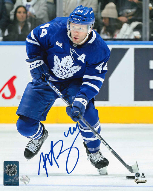 Morgan Rielly Signed Toronto Maple Leafs Blue Carrying Puck 8x10 Photo - Frameworth Sports Canada 