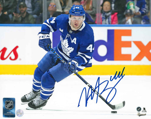 Morgan Rielly Signed Toronto Maple Leafs Blue Skating With Puck 8x10 Photo - Frameworth Sports Canada 