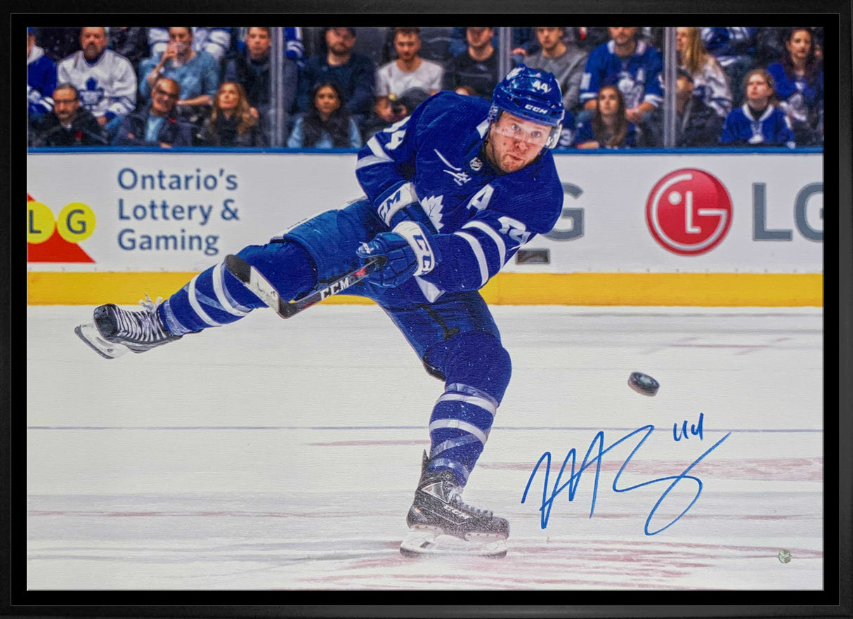 Morgan Rielly Toronto Maple Leafs Signed Framed 20x29 Shooting Canvas - AUCTION