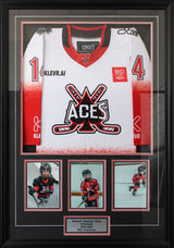 Vertical shadow box with red and black double matting featuring three-photo layout below centered jersey