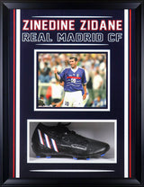 Vertical shadow box with navy matting, red and white accent borders, and dual-opening cleat display