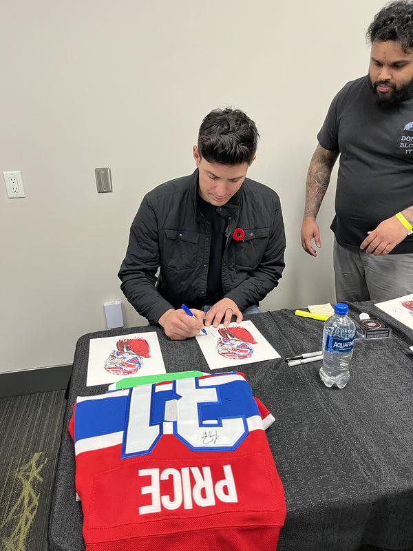 Carey Price at the signing table with a signed Canadiens jersey, Toronto Sport Card Expo 2023