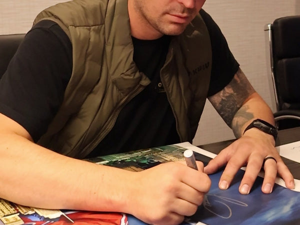 Carey Price signing a canvas at a Frameworth signing, 2024