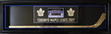 Horizontal shadow box with blue accent matting featuring hockey stick display and centered team photo