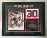 Multi-opening frame with charcoal matting, red accent borders, and balanced three-piece composition