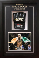 Deep shadow box with gold foil typography, centered glove mount, and dual-photo vertical layout